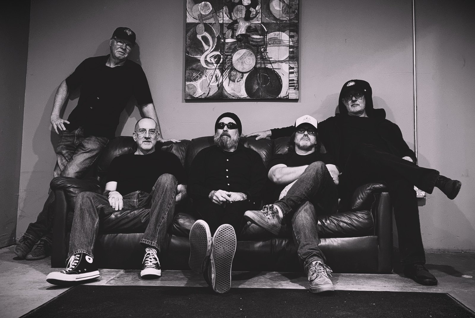 Radio NotRadio, a Sacramento-area psychedelic stoner rock band, black and white band photo on couch
